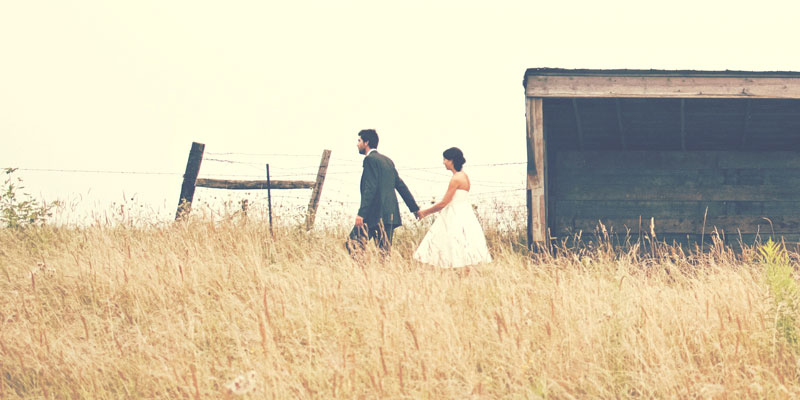 Letting Our Husbands Lead | couple walking in field
