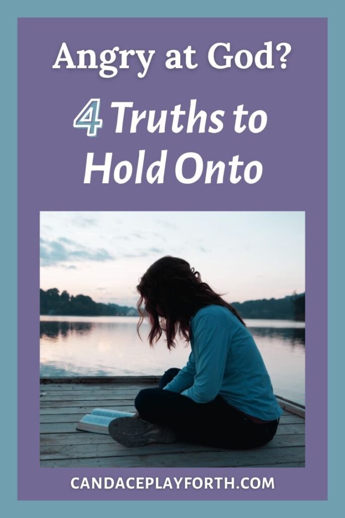 woman reading Bible by lake | Pin when you're angry at God