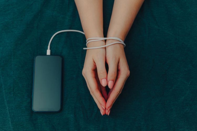 woman bonded to her phone image