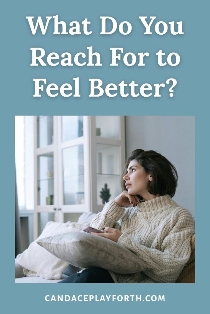 woman on couch looking out window | what I reach for pin 
