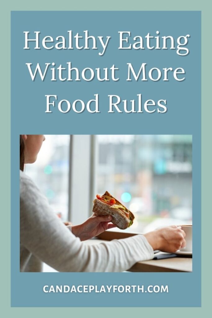 woman eating sandwich | healthy eating less food rules pin